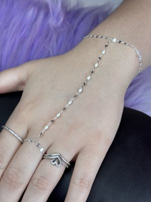 HAND CHAINS - For the woman who moves like she already knows she’s "that girl".
Our hand chains are the kind of detail that doesn’t scream, it "whispers luxury". Effortless, intentional, and always noticed. The way it drapes across your hand, catches the light, and elevates everything you’re wearing… it’s a quiet statement that says you pay attention to the details.
Each piece is "custom-fit and seamlessly welded" for that clean, clasp-free look, like it was made just for you (because it is).
We work exclusively with "high-quality Italian chains" in .925 Italian Sterling Silver, 14k Gold-Filled, and 14k White & Yellow Solid Gold selected for their lasting shine, durability, and ability to be worn every single day without losing their beauty.
What makes this piece even more special is how customizable it is.
You can mix chain styles, layer textures, or combine different links to create something that feels completely your own: minimal and refined or bold and dimensional.
And because we design with real life in mind, every piece comes with our "lifetime warranty".
If life happens: travel, surgeries, day-to-day wear, we’ve got you covered, as long as you have your chain. We’ll always be here to keep it looking and fitting exactly how it should.
"This isn’t trend jewelry.
It’s your signature." - Carmen @ Bijut HAND CHAINS - For the woman who moves like she already knows she’s "that girl".
Our hand chains are the kind of detail that doesn’t scream, it "whispers luxury". Effortless, intentional, and always noticed. The way it drapes across your hand, catches the light, and elevates everything you’re wearing… it’s a quiet statement that says you pay attention to the details.
Each piece is "custom-fit and seamlessly welded" for that clean, clasp-free look, like it was made just for you (because it is).
We work exclusively with "high-quality Italian chains" in .925 Italian Sterling Silver, 14k Gold-Filled, and 14k White & Yellow Solid Gold selected for their lasting shine, durability, and ability to be worn every single day without losing their beauty.
What makes this piece even more special is how customizable it is.
You can mix chain styles, layer textures, or combine different links to create something that feels completely your own: minimal and refined or bold and dimensional.
And because we design with real life in mind, every piece comes with our "lifetime warranty".
If life happens: travel, surgeries, day-to-day wear, we’ve got you covered, as long as you have your chain. We’ll always be here to keep it looking and fitting exactly how it should.
"This isn’t trend jewelry.
It’s your signature." - Carmen @ Bijut