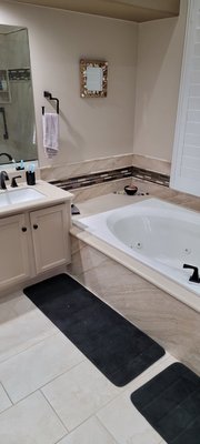 Master Bathroom Remodel 2024 - This was an older styling of tile in a Master Bathroom that we were asked to revamp. The old garden tub and shower stall with curb were deleted. Now, the Tub/Shower area is all zero entry, ready for a free-standing tub, and also shower glass that will partition off the shower. Master Bathroom Remodel 2024 - This was an older styling of tile in a Master Bathroom that we were asked to revamp. The old garden tub and shower stall with curb were deleted. Now, the Tub/Shower area is all zero entry, ready for a free-standing tub, and also shower glass that will partition off the shower.