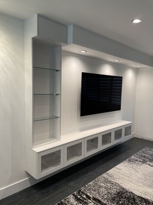 Modern White Floating Media Cabinet - Modern White Floating Media Cabinetry in Orange CA. Client was offered pricing virtually, then our rep went onsite to confirm measurements, colors, styles; and sign a contract to start the project. Modern White Floating Media Cabinet - Modern White Floating Media Cabinetry in Orange CA. Client was offered pricing virtually, then our rep went onsite to confirm measurements, colors, styles; and sign a contract to start the project.