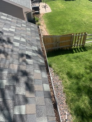 Gutter Clean - Before and after photo of a client in need of gutter cleaning.