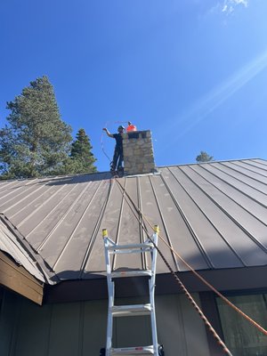 removed the broken bricks and installed a custom chase top with a flue cap. - removed the broken bricks and installed a custom chase top with a flue cap.
