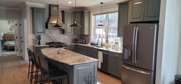 Madison CT Kitchen Cabinet Painting - The homeowner reached out to New Haven Painters to upgrade their kitchen. They did not like the outdated feel of their cabinets and wanted to give their kitchen a modern feel that stood out, yet complimented their interior walls. We got to work right away, spray painting the cabinets. The results speak for themselves!