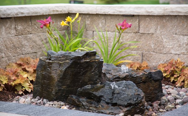 Fountainscapes - BENEFITS
Aesthetic Enhancement: Decorative water features add a visually appealing element to your landscape. They introduce a sense of elegance and sophistication that can elevate the overall look of your outdoor area.
Space Optimization: Water features like fountains, bubbling urns, and fountain rocks take up minimal space while still offering a significant impact. This is especially useful for smaller outdoor areas where space is a premium.
Wildlife Attraction: Recirculating water features attract various creatures such as birds, butterflies, hummingbirds, and dragonflies. This adds a touch of nature and biodiversity to your landscape, making it more vibrant and lively.
Customization: Water features come in various styles, sizes, and designs, allowing you to choose the one that best fits your personal taste and complements your landscape.
Entertainment and Gathering Space: A water feature can create a focal point for outdoor gatherings and provide a soothing backdrop for social interactions.
Incorporating decorative water features into your outdoor space offers a range of benefits that enhance both the aesthetics and functionality of your landscape. Fountainscapes - BENEFITS
Aesthetic Enhancement: Decorative water features add a visually appealing element to your landscape. They introduce a sense of elegance and sophistication that can elevate the overall look of your outdoor area.
Space Optimization: Water features like fountains, bubbling urns, and fountain rocks take up minimal space while still offering a significant impact. This is especially useful for smaller outdoor areas where space is a premium.
Wildlife Attraction: Recirculating water features attract various creatures such as birds, butterflies, hummingbirds, and dragonflies. This adds a touch of nature and biodiversity to your landscape, making it more vibrant and lively.
Customization: Water features come in various styles, sizes, and designs, allowing you to choose the one that best fits your personal taste and complements your landscape.
Entertainment and Gathering Space: A water feature can create a focal point for outdoor gatherings and provide a soothing backdrop for social interactions.
Incorporating decorative water features into your outdoor space offers a range of benefits that enhance both the aesthetics and functionality of your landscape.