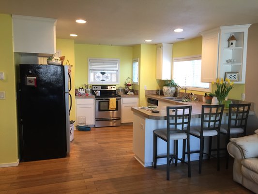 Kitchen remodeling - This remodel was a kitchen based in stain, our client dreamed have them in a white shining color so we took action and repaired holes and caulked the hole kitchen and painted them, living a dream come true and a beautiful looking new kitchen