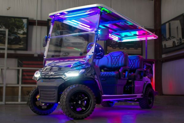 NEW 2022 ADVANCED EV ADVENT-6 - Custom upgrades:

Custom seating
12x7 SS wheels in black
20x10.00R12 GTW tires
Color change LED lighting under roof & under floor
Wet Sounds Bluetooth sound bar
Wet Sounds under seat subwoofer

Factory upgrades:

Folding windshield
Factory highlights:
Factory 2" lift
Electronic parking brake
Disc Brakes
Headlights
Tail lights
Turn signals
Covered storage under front seat
Cubby storage under rear seat
Rear flip seat
Speedometer
Battery gauge
Key to start
Side view mirrors
Seat belts
Back-up alarm
Built-in 12 volt converter (for adding accessories like stereo or LED lighting)

Tech Specs:

Motor: Brushless 4KW
Voltage: 48V (8Vx6)
Charger: Intelligent Onboard Charger
Transaxle: 16:1
Seating Capacity: 6 people
Forward Speed: 22 MPH