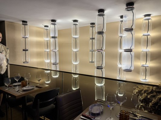 Flatiron Restaurant - In this project we created drapes for each chandelier light to cover the brightness to the customers.