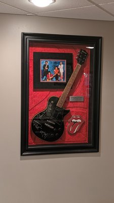 Rolling Stone Display Case - This customer wanted his signed Rolling Stones guitar recessed into the wall.  We opened up the wall and framed in the opening.  We then trimmed out the display and painted it black. 

We had a great time design/building this project with the customer.