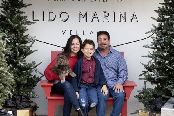 Family Holiday Session - Casual holiday photos for this family in Newport Beach. We went to Lido Marina Village where there was already a holiday setup for photos, walked along the marina in front of the boats. Kid and pet frienfly place and it made it fun to have both in this photoshoot.