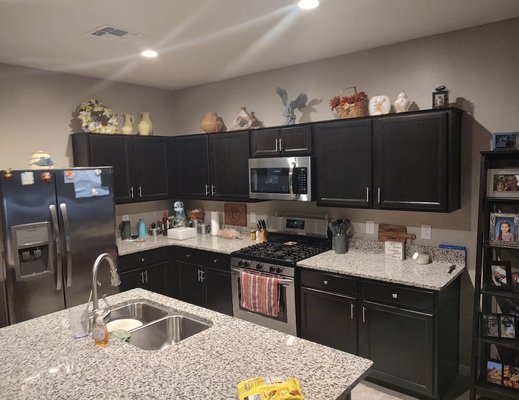 Kitchen Cabinets dark brown to GREEN - From dark brown to a nice green. We took our time in the prep work which is super important.

All products used were from Sherwin-Williams. Extreme Bond Primer and Emerald Urethane paint. :)