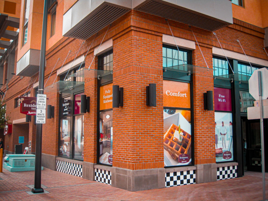 Exterior Wall & Window Wraps - Let Wrap City design, print, and install the new face of your business. With our extensive expertise in materials and inks, we can customize the perfect product to meet your specific needs. Whether you're looking to transform a 10-foot glass storefront or a sprawling 150-foot concrete wall, our team has the skills and knowledge to bring your vision to life. We understand that each project is unique, which is why we offer personalized solutions to ensure your business stands out. From vibrant graphics to durable, weather-resistant finishes, Wrap City is your partner in creating eye-catching displays that leave a lasting impression.
Residence Inn - Exterior Window Wrap
Wrap City had the pleasure of working with Residence Inn, transforming their windows with our stunning vinyl wraps. Our Wraps not only enhanced the hotel's exterior but also provided privacy and UV protection for their guests. Exterior Wall & Window Wraps - Let Wrap City design, print, and install the new face of your business. With our extensive expertise in materials and inks, we can customize the perfect product to meet your specific needs. Whether you're looking to transform a 10-foot glass storefront or a sprawling 150-foot concrete wall, our team has the skills and knowledge to bring your vision to life. We understand that each project is unique, which is why we offer personalized solutions to ensure your business stands out. From vibrant graphics to durable, weather-resistant finishes, Wrap City is your partner in creating eye-catching displays that leave a lasting impression.
Residence Inn - Exterior Window Wrap
Wrap City had the pleasure of working with Residence Inn, transforming their windows with our stunning vinyl wraps. Our Wraps not only enhanced the hotel's exterior but also provided privacy and UV protection for their guests.
