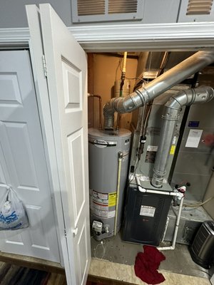 Water heater install - Instal was made without a drain pan due to tight space. We added a water alarm device Water heater install - Instal was made without a drain pan due to tight space. We added a water alarm device