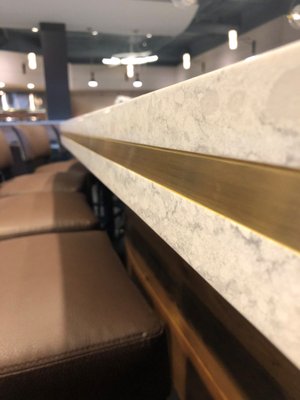 Commercial Project: Main & Vine - The Main and Vine Bistro
🔅Main Bar
🔅Table Tops
🔅Wine Cellars
The main bar top features a triple laminated edge with a brass insert!
This quartz consists of grey vein swirls around speckles of beige on a creamy white background. Commercial Project: Main & Vine - The Main and Vine Bistro
🔅Main Bar
🔅Table Tops
🔅Wine Cellars
The main bar top features a triple laminated edge with a brass insert!
This quartz consists of grey vein swirls around speckles of beige on a creamy white background.