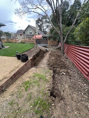 New Retaining Wall - Customer wanted a new strong Block retaining wall With stucco finish  due to the old wood one that rotted out