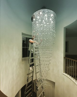 chandelier installation - Ceilling Electric proudly completed an exquisite chandelier installation that transformed the ambiance of a grand dining room in a prestigious home. This project was meticulously planned and executed to ensure both aesthetic appeal and optimal functionality.