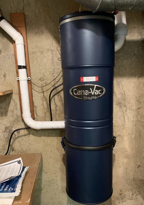 Central Vacuum Installation - The original central vacuum unit needed to be replaced after the motor had burnt out. The new central vacuum unit that we installed is a Canavac LS690 and has HEPA filtrated bags, a muffler to suppress the sound of the motor, and a 20 year motor warranty. The new unit requires much easier maintenance than the old bagless one, so the customers were very satisfied.