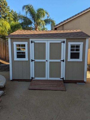 10'x12' Ranch Style Gable Shed with Loft - Our client needed a shed but had limited access to get a prebuilt delivery. We were able to provide this beautiful gable, ranch style storage shed solution at a similar or better cost and in far less time! This Rocklin, CA with backyard shed included: A storage loft, custom paint to match our client's home, standard 6'.5" walls, a 5/12 pitch roof, 2"x4" framing built 16" on center, desert tan- 30 year architectural shingles, 5 foot double doors with locking tee-handle, heavy duty ramp for riding or rolling items in and out and radiant barrier roof sheathing to help keep the shed cool in summer. We'd love to design a shed for you! 10'x12' Ranch Style Gable Shed with Loft - Our client needed a shed but had limited access to get a prebuilt delivery. We were able to provide this beautiful gable, ranch style storage shed solution at a similar or better cost and in far less time! This Rocklin, CA with backyard shed included: A storage loft, custom paint to match our client's home, standard 6'.5" walls, a 5/12 pitch roof, 2"x4" framing built 16" on center, desert tan- 30 year architectural shingles, 5 foot double doors with locking tee-handle, heavy duty ramp for riding or rolling items in and out and radiant barrier roof sheathing to help keep the shed cool in summer. We'd love to design a shed for you!
