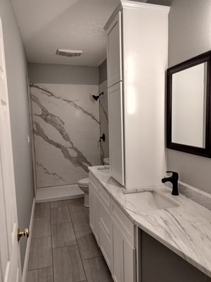 Hall bathroom remodel - This is another bathroom remodel where we replaced the vanity with custom built vanity and linen cabinet. We installed a porcelain shower. Then we replaced the floors and painted as well. Hall bathroom remodel - This is another bathroom remodel where we replaced the vanity with custom built vanity and linen cabinet. We installed a porcelain shower. Then we replaced the floors and painted as well.