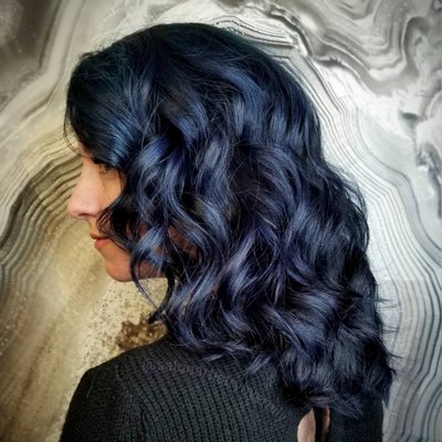 Midnight Denim Delicacy - Hair Color, Haircut, and Hair Style - Amazing hair like this can be a long term commitment to achieve. But just look at those results!! This particular appoinment started with 1/2 inch outgrowth and faded blue hair color. Lightener with Niophlex was applied to outgrowth and allowed to process to light yellow. Hair was rinsed and clarified. Roots were toned to cancel remaining warmth. Hair was again rinsed, clarified, and dried. One root and lowlight color and one base color were created with IDHAIR colour bombs and Niophlex. These were applied in a balayage pattern, and allowed to process for 45 minutes. Hair was rinsed, conditioned, trimmed, dried, and styled. The result was stunning! Of course, it's easy to take a good picture of Kim.... Midnight Denim Delicacy - Hair Color, Haircut, and Hair Style - Amazing hair like this can be a long term commitment to achieve. But just look at those results!! This particular appoinment started with 1/2 inch outgrowth and faded blue hair color. Lightener with Niophlex was applied to outgrowth and allowed to process to light yellow. Hair was rinsed and clarified. Roots were toned to cancel remaining warmth. Hair was again rinsed, clarified, and dried. One root and lowlight color and one base color were created with IDHAIR colour bombs and Niophlex. These were applied in a balayage pattern, and allowed to process for 45 minutes. Hair was rinsed, conditioned, trimmed, dried, and styled. The result was stunning! Of course, it's easy to take a good picture of Kim....