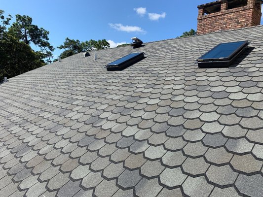 Specialty Shingle Installation - This homeowner wanted a shingle that had an upgraded aesthetic. Sonshine installed this scallop-edged shingle in shades of stormy gray. Specialty Shingle Installation - This homeowner wanted a shingle that had an upgraded aesthetic. Sonshine installed this scallop-edged shingle in shades of stormy gray.