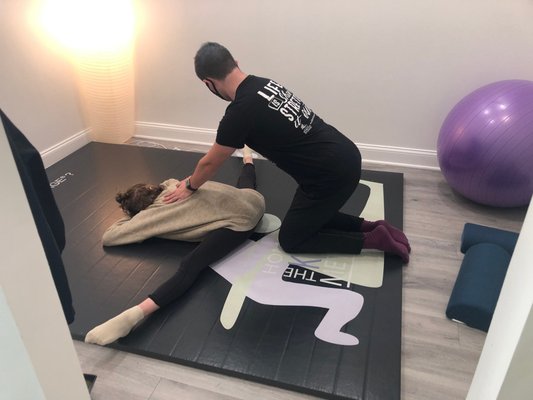 Stretch Session with Coach Jacob - Our client, a dancer, is achieving great therapeutic results from her stretching sessions with Coach Jacob. Call us today so you can improve your flexibility and release tension!