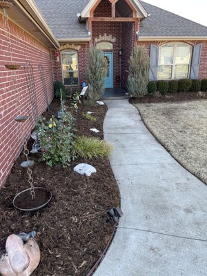 Landscaping installation - Trees, plants and mulch install. Drains off of down spouts. Rock beds where it was washing out and a flagstone path. Landscaping installation - Trees, plants and mulch install. Drains off of down spouts. Rock beds where it was washing out and a flagstone path.