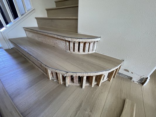 Round step with vinyl planks - This was a tricky job because of the round step Customer reached out because his original installer couldn’t figure it out. We were lucky enough to have experience with this so we made the stair nose and color match stain and installed it.
