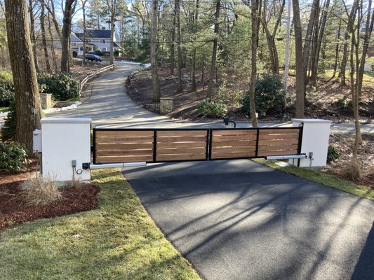 Motorized gate in Weston - Custom horizontal board gate, motorized. Red cedar boards, steel frame.