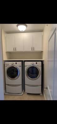 Laundry function - We removed the old metal single wire rack installed by the builder. We added two big upper cabinets for storage and a folding countertop above the washer and dryer. Laundry function - We removed the old metal single wire rack installed by the builder. We added two big upper cabinets for storage and a folding countertop above the washer and dryer.
