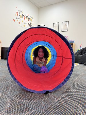 Tunnel play - Tunnel play is a great way for the child to develop patience and turn-taking skills when they choose to participate in cooperative play activities with the SLP.