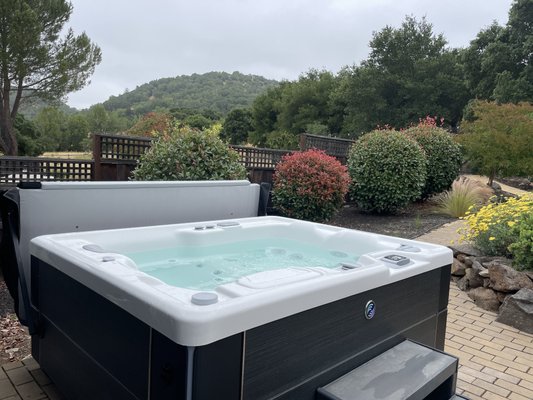 Hot Tub backyard oasis - This backyard hot tub oasis has a beautiful new Hot Spring Highlife Collection spa with the exclusive saltwater sanitizing system for silky smooth soft water that never has chemical smells. It’s the best of the best! Hot Tub backyard oasis - This backyard hot tub oasis has a beautiful new Hot Spring Highlife Collection spa with the exclusive saltwater sanitizing system for silky smooth soft water that never has chemical smells. It’s the best of the best!