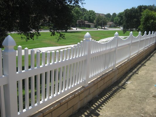 Swooped Picket Vinyl Fence - Vinyl is a great way to help your fence last a lifetime! Ask us about our vinyl options, with multiple styles, textures, and colors.