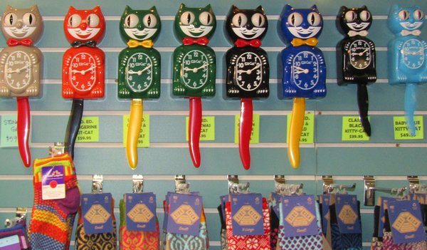 Kit Cat Clocks & Puzzles - Still made in the USA, the Kit Cat Clock brings smiles to all ages and fond memories of your grandmother’s kitchen when she served up warm cookies! Today the clocks are battery operated. If not hanging your Kit Cat on a wall consider placing it on a clear plastic stand sitting on your counter or work desk. These cats and kitties have a friendly soul and a gentle tick-tock.
Puzzles fit the bill when you need distraction from everyday “mishmash.” They range from small-count in decorative tins to 275-piece easy-handling to 1000 pieces that take a long time for one person to finish. Some puzzles are designed with smaller pieces on one edge to larger pieces on the opposite edge to encourage those with varied skills to work together. (Isn’t that ingenious!). Puzzles are selected from high-quality manufacturers and a broad range of themes. Kit Cat Clocks & Puzzles - Still made in the USA, the Kit Cat Clock brings smiles to all ages and fond memories of your grandmother’s kitchen when she served up warm cookies! Today the clocks are battery operated. If not hanging your Kit Cat on a wall consider placing it on a clear plastic stand sitting on your counter or work desk. These cats and kitties have a friendly soul and a gentle tick-tock.
Puzzles fit the bill when you need distraction from everyday “mishmash.” They range from small-count in decorative tins to 275-piece easy-handling to 1000 pieces that take a long time for one person to finish. Some puzzles are designed with smaller pieces on one edge to larger pieces on the opposite edge to encourage those with varied skills to work together. (Isn’t that ingenious!). Puzzles are selected from high-quality manufacturers and a broad range of themes.