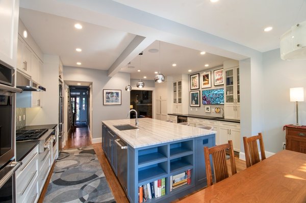 Kitchen/Dining room renovation - "The kitchen and dining room was divided with the wall, which was removed to create an open space. The older version of the kitchen layout didn't have enough counter space so bigger custom made kitchen island was built and installed. The multi color effect of the kitchen island cabinets subtly divides the kitchen and dining area. Contact us for design ideas and pre-construction services. " Kitchen/Dining room renovation - "The kitchen and dining room was divided with the wall, which was removed to create an open space. The older version of the kitchen layout didn't have enough counter space so bigger custom made kitchen island was built and installed. The multi color effect of the kitchen island cabinets subtly divides the kitchen and dining area. Contact us for design ideas and pre-construction services. "