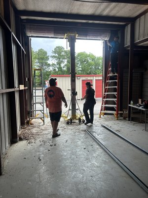 Go store it self storage in Bluffton barn door replacement - Replacement of old outdated barn swing doors they were taken down and removed. We installed a 12’ x 12’ Janus commercial grade, rollup, garage door, patriot red in color