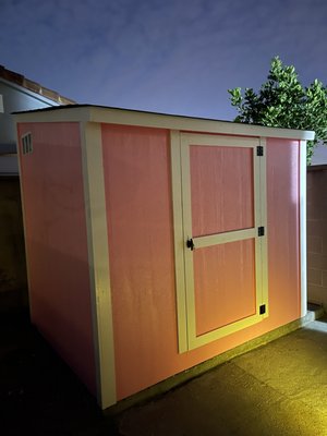 Custom Storage Shed - This build here is 8x6. Height of the walls are 7 feet back wall and 6 feet front wall. She wanted the shed painted pink and white trim. Before building the shed, we demolished the old metal shed and hauled to dump. We cleaned the site and prepared the area. The Shed came out great and the customer loved it. In comparison to the old shed, I'd say night and day difference.