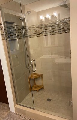 Frameless shower door - This shower door was installed in a shower that was recently tiled. It was a great way to finish of the shower! Frameless shower door - This shower door was installed in a shower that was recently tiled. It was a great way to finish of the shower!