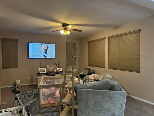 Living room remodel - Customer wanted something to brighten up the living room new paint and curtain installation