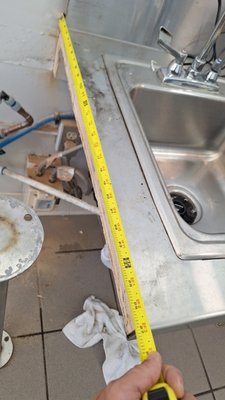 Stainless steel desk. - A guy at a retail outlet needed to cut out a section of stainless steel table and raise it 6 inches. I did it. It took a whole day. All that's left is to make it pretty.