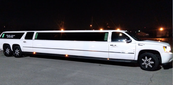 White Escalade Stretch Limo - Features: Seats 25, Bluetooth, Leather Seats, Rear Ac & Cooling Space For Drinks & Ice. Book a Resveration Today!