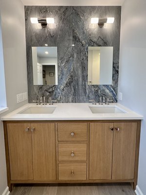 Bathroom Remodeling - In this bathroom remodel we changed the layout by relocating the toilet to accommodate the new double vanity, completely redid the shower stall, added radiant heat and new tile to the main floor, fabricated and installed the custom vanity, installed a new tile backsplash. Bathroom Remodeling - In this bathroom remodel we changed the layout by relocating the toilet to accommodate the new double vanity, completely redid the shower stall, added radiant heat and new tile to the main floor, fabricated and installed the custom vanity, installed a new tile backsplash.