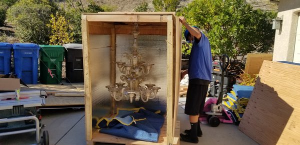 Specialty Items & Piano Moving - What is a specialty item? Items that take special equipment and expertise to move safely, or items that go above and beyond the normal scope of moving boxes and household goods. This could be a grandfather clock, competition slate billiard table, piano, large statue, artwork or geode, but could also include rigging or hoisting with specialized anchors up to a balcony with use of ropes, pulleys, ascenders, scissor lift, boom lifts, or a crane service. We excel in these creative and often hazardous situations and pricing will reflect the difficulty of the job.
First photos are taken from one of three hand blown glass chandeliers that were crated and packed for storage. From planning the crate build for storage and transit, to removing the chandeliers from the house, to walking it to the prebuilt crate, to crate placement, and final packing, this was a precision job. What a unique piece to be entrusted with! Specialty Items & Piano Moving - What is a specialty item? Items that take special equipment and expertise to move safely, or items that go above and beyond the normal scope of moving boxes and household goods. This could be a grandfather clock, competition slate billiard table, piano, large statue, artwork or geode, but could also include rigging or hoisting with specialized anchors up to a balcony with use of ropes, pulleys, ascenders, scissor lift, boom lifts, or a crane service. We excel in these creative and often hazardous situations and pricing will reflect the difficulty of the job.
First photos are taken from one of three hand blown glass chandeliers that were crated and packed for storage. From planning the crate build for storage and transit, to removing the chandeliers from the house, to walking it to the prebuilt crate, to crate placement, and final packing, this was a precision job. What a unique piece to be entrusted with!