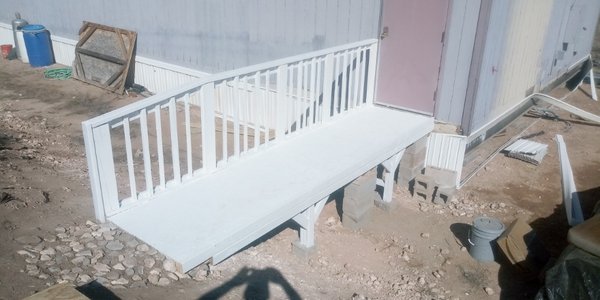 Access Bridge - This access bridge was installed to permit easy access to a storage building and allow for a dolly to move large items in and out. Access Bridge - This access bridge was installed to permit easy access to a storage building and allow for a dolly to move large items in and out.