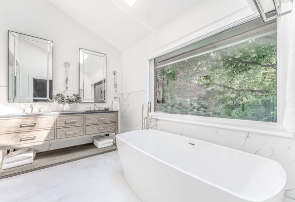 Exquisite Fully Loaded Master Bathroom in East Hills - Exquisite Contemporary/Modern Master Bathroom Renovation in the heart of East Hills, New York showcasing HOMEREDI Design & Build expertise combined by a Young Couple's Phenomenal Taste in Interior Design, Luxury Product selection and an amazing eye for great detail resulted in creation of a spacious and inviting Resort Style Fully loaded Master Bathroom as part of an adjoining and spacious Master Bedroom Suite.
Bathroom - large modern master white tile and porcelain tile porcelain tile, white floor, double-sink and vaulted ceiling bathroom idea in New York with furniture-like cabinets, light wood cabinets, a two-piece toilet, white walls, an undermount sink, marble countertops, a hinged shower door, gray countertops and a freestanding vanity. Exquisite Fully Loaded Master Bathroom in East Hills - Exquisite Contemporary/Modern Master Bathroom Renovation in the heart of East Hills, New York showcasing HOMEREDI Design & Build expertise combined by a Young Couple's Phenomenal Taste in Interior Design, Luxury Product selection and an amazing eye for great detail resulted in creation of a spacious and inviting Resort Style Fully loaded Master Bathroom as part of an adjoining and spacious Master Bedroom Suite.
Bathroom - large modern master white tile and porcelain tile porcelain tile, white floor, double-sink and vaulted ceiling bathroom idea in New York with furniture-like cabinets, light wood cabinets, a two-piece toilet, white walls, an undermount sink, marble countertops, a hinged shower door, gray countertops and a freestanding vanity.