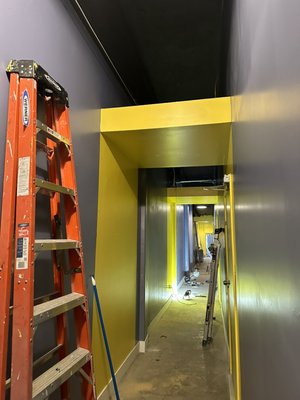 repainting and finishing of neon - Made from an unfortunate black corridor, the colored and rainbow entrance to the recording studio