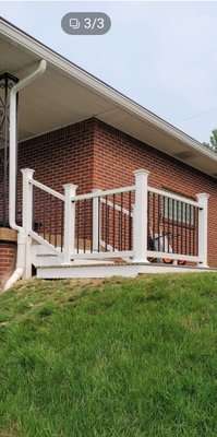 Trex landing with railings - customer wanted the landing larger. we build a wood frame over the concrete then added Trex flooring and railings. There was a slight slope of ground on the backside of the concrete landing, so by adding the railings, this helped secure that no one would have any accidents.