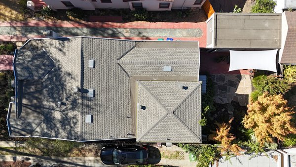 Flat and Shingle Roof Replacement in Oakland, CA Completed by ELM Roofing Contractors - When this homeowner in Oakland, CA called us for a roof inspection, the signs were clear: both the flat and pitched roof sections needed replacements. Our team at ELM Roofing Contractors designed a two-part solution to handle both systems — delivering a longer-lasting roof that also looked sharp from the street.
We began by tearing off multiple layers of material, including asphalt shingles and built-up membrane. For the shingle section, we installed GAF Timberline HDZ RS shingles over synthetic underlayment for superior leak protection. These shingles were selected not only for performance, but because their light-reflective surface meets California’s cool roof requirements — helping the homeowner save on energy costs.
The flat roof, spanning over 1,800 sq ft, was rebuilt using a multi-layer modified bitumen torch-down system. Each layer — from the Glasbase base to the Flintlastic cap sheet — was applied with precision, making this surface strong enough to withstand sun, heat, and pooling water year-round.
Beyond the roof, the client asked us to address siding damage on the detached garage. We removed the existing wood siding and replaced it with new sheathing, waterproof barrier, and matching planks, primed and painted to match the home’s palette.
The result? A functional roof system that boosts curb appeal, meets local code, and performs in every season. Flat and Shingle Roof Replacement in Oakland, CA Completed by ELM Roofing Contractors - When this homeowner in Oakland, CA called us for a roof inspection, the signs were clear: both the flat and pitched roof sections needed replacements. Our team at ELM Roofing Contractors designed a two-part solution to handle both systems — delivering a longer-lasting roof that also looked sharp from the street.
We began by tearing off multiple layers of material, including asphalt shingles and built-up membrane. For the shingle section, we installed GAF Timberline HDZ RS shingles over synthetic underlayment for superior leak protection. These shingles were selected not only for performance, but because their light-reflective surface meets California’s cool roof requirements — helping the homeowner save on energy costs.
The flat roof, spanning over 1,800 sq ft, was rebuilt using a multi-layer modified bitumen torch-down system. Each layer — from the Glasbase base to the Flintlastic cap sheet — was applied with precision, making this surface strong enough to withstand sun, heat, and pooling water year-round.
Beyond the roof, the client asked us to address siding damage on the detached garage. We removed the existing wood siding and replaced it with new sheathing, waterproof barrier, and matching planks, primed and painted to match the home’s palette.
The result? A functional roof system that boosts curb appeal, meets local code, and performs in every season.