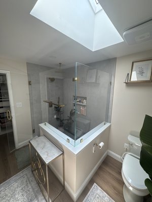 Custom 90 degree angled shower - Custom Shower enclosure for the new updated master bathroom. Completed with low-iron ultra clear safety glass and custom gold color hardware to match the brand new shower hardware color. Perfect alignment, custom measurements, and precise work are essential to our speciality.