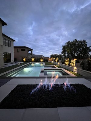 Back Yard Landscape Installation - This was a full and complete re-do of a back yard in Orange County.  Built a covered CA room, fireplace, water feature, etc... This is a backyard oasis.