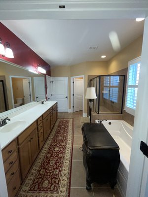 Bathroom Refresh: Walls and Sprayed Cabinetry – Complete Renovation - Teal-blue walls with matching sprayed cabinetry for a durable, high-end finish. Reach out today for a free 10% off for first-time clients. Begin your project on your terms, with our expert guidance.