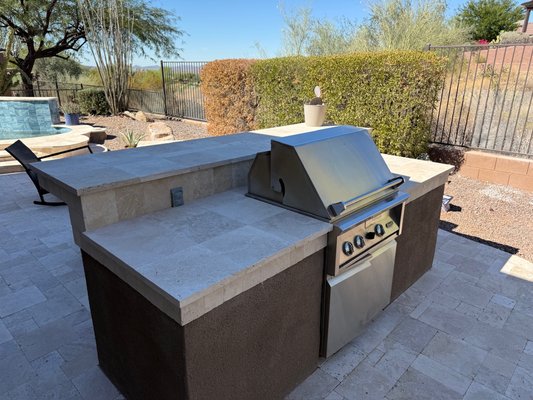 Custom Outdoor Kitchens - A collection of custom outdoor kitchen projects designed and built for Arizona outdoor living. These installations include features such as built-in BBQ grills, cooktops, sinks, beverage refrigerators, and spacious prep countertops. Many of these kitchens are paired with pergolas, paver patios, and seating areas to create complete outdoor entertaining spaces. Each project is tailored to the homeowner’s backyard layout and built with durable materials suited for the Arizona climate. Custom Outdoor Kitchens - A collection of custom outdoor kitchen projects designed and built for Arizona outdoor living. These installations include features such as built-in BBQ grills, cooktops, sinks, beverage refrigerators, and spacious prep countertops. Many of these kitchens are paired with pergolas, paver patios, and seating areas to create complete outdoor entertaining spaces. Each project is tailored to the homeowner’s backyard layout and built with durable materials suited for the Arizona climate.